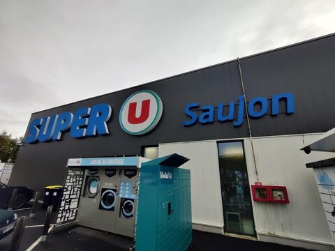 Saujon, France - October 25, 2025: Super U. Super U supermarket in Saujon, France, showcasing modern architecture and branding, with automated services and vibrant signage for shoppers