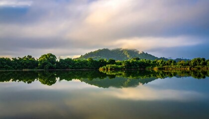 Obraz premium Serene Lake with Mountain and Trees Reflection.