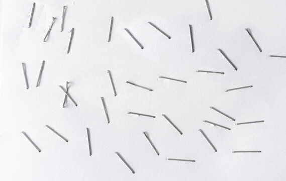 Staples pushed into a paper, metal office staple needles