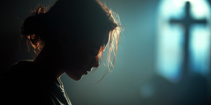 atmospheric photography of person with ash cross on forehead in prayer for ash wednesday spiritual reflection