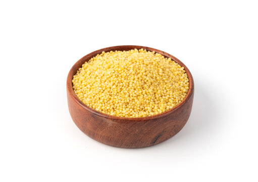 Raw millet grains pile isolated. Little yellow cereal, natural foxtail small seeds