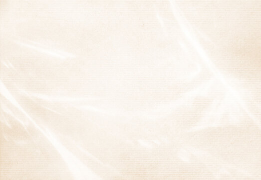 Beige textured canvas background with translucent plastic overlay and highlights