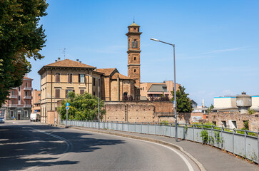 Fototapeta premium SS-9 Via Emilia road with a view to the church of Santa Maria in Torricella in Piacenza city, Emilia-Romagna region, Italy