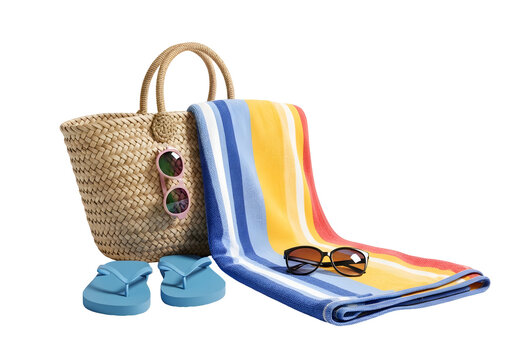 A beach bag, a spread-out towel, blue flip-flops, and sunglasses.
