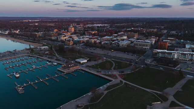 Timelapse view of downtown Traverse City, MI and the Clinch Marina.  Drone is pulling away from the city going backwards.  Shot on DJI Air 3s in 4k.  5 Seconds.