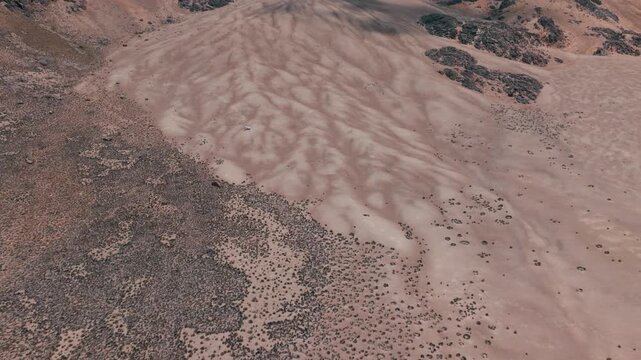 Aerial view of volcanic peaks, alpine lakes and rugged terrain in Sajama National Park, Bolivia. A remote high-altitude landscape in the Andes.