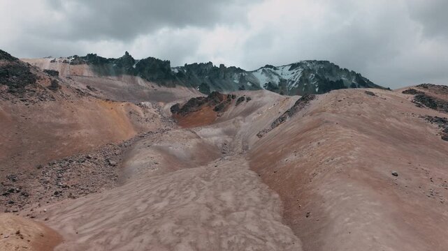 Aerial view of volcanic peaks, alpine lakes and rugged terrain in Sajama National Park, Bolivia. A remote high-altitude landscape in the Andes.