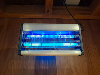 Electric ultraviolet insecticide insect killer, effective UV lamp trap in shop © Harmony Video Pro