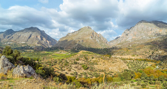 Preveli Beach, Crete, Greece: Mountain valley with olive groves and cloudy sky