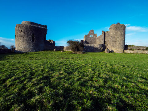 Stunning old fortress castle in Roscommon town, Ireland. Famous tourist attraction with nice green park and amazing view. Powerful stone wall and towers to protect important people. Irish history.