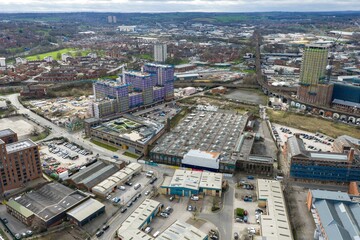 Aerial drone view of modern apartment complex in Leeds city centre showing residential blocks balconies roads and urban housing development in West Yorkshire England © Duncan