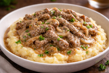 Beef Stroganoff With Mushrooms Over Creamy Mashed Potatoes