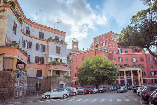 Garbatella, Rome, Italy: Street with buildings and parked cars