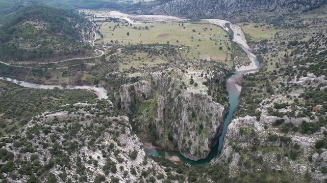 Located on the historic St Paul Trail in Antalya, the Gavurevi rock tomb features unique Roman architecture and rare hunter reliefs overlooking the Eurymedon River.