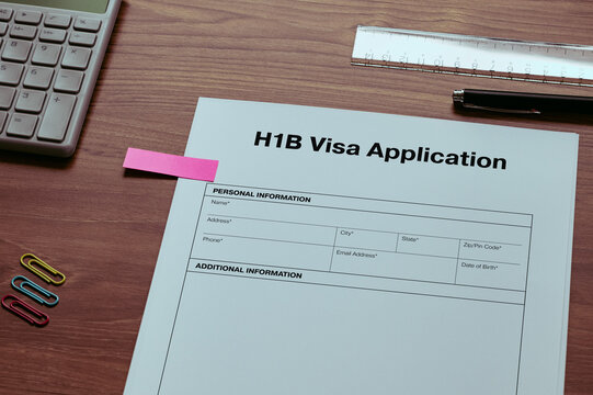H1B Visa Application: Realistic mock-up mock placed on  with ruler, calculator, sticky note. Contributor-created fictional business document for illustrative purposes.