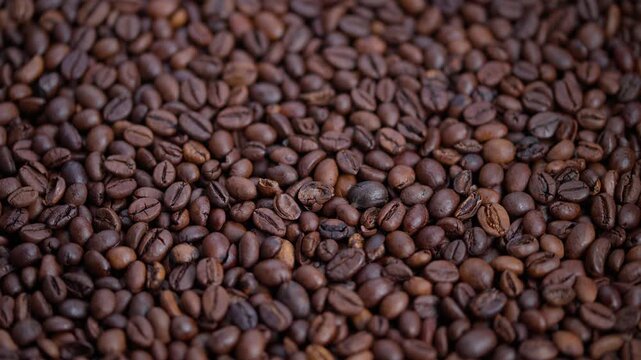 Dark roasted beans, Rich aroma and detailed texture of roasted coffee beans, Cozy cafe scene showcasing shiny roasted beans with subtle oil sheen and detailed creases