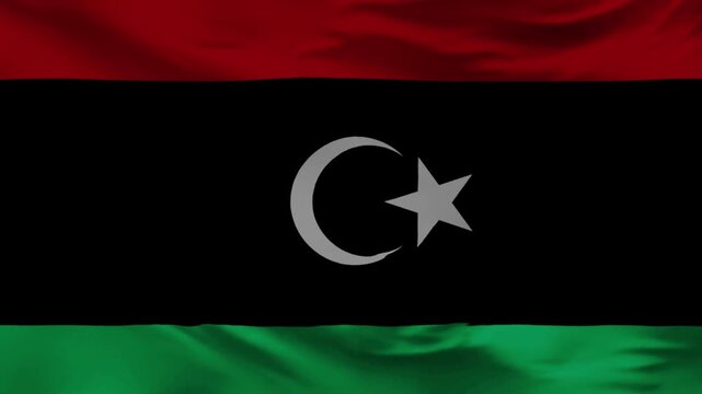 Libyan Flag: An artistic view of the Libyan flag. The flag flows gently in the wind, with its symbolism of national identity.  