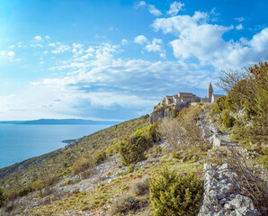 Fototapeta premium Lubenice, Cres Island, Croatia: Coastal village on a cliff overlooking the sea