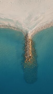 Roccella Ionica Beach, an Italian tourist destination in summer aerial overhad