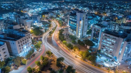 Obraz premium Aerial Night View of Cityscape with Light Trails and Urban Life