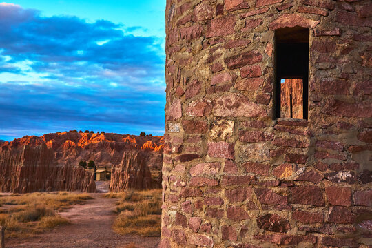 Abandoned CCC Water Tower and Cathedral Gorge Cliffs at Sunset Nevada