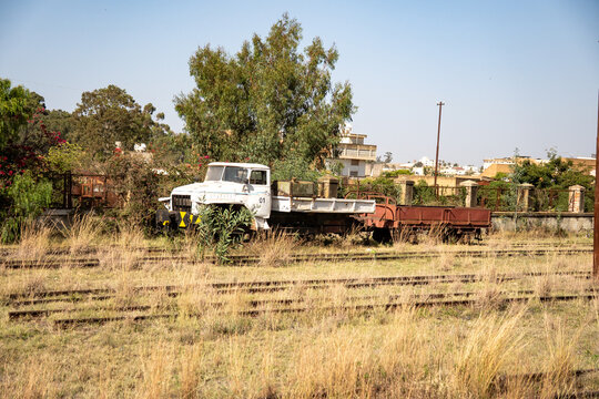 Old, abandoned vehicles by the tracks at the railway station in Asmara, Eritrea
