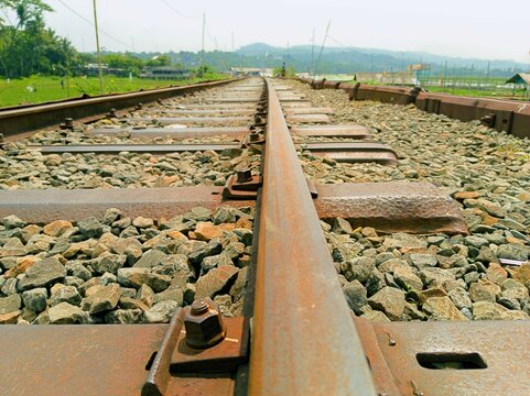 ANTIQUE TRAIN RAILS ALONG RAWA PENING LAKE IN THE AMBARAWA OLD TRAIN STATION AREA