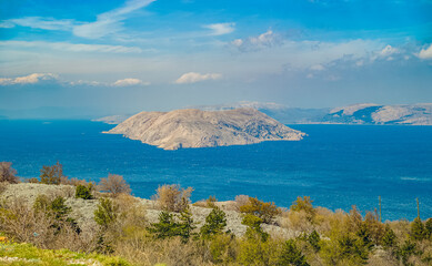 Prvić Island, Croatia: Island in blue sea with rocky coast and vegetation © Elsworth Frobisher