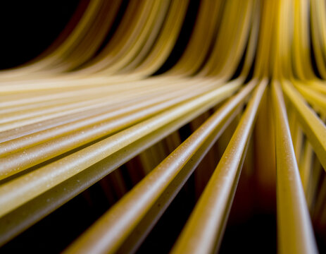 Extreme close-up of spaghetti noodles forming parallel lines