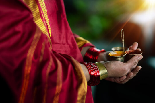 Woman's hands holding kukum and turmeric 