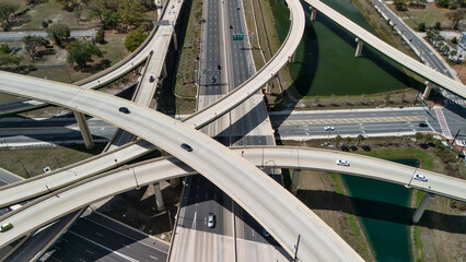 Naklejka premium Top down aerial highway interchange with crossing overpasses