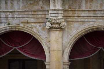 Fototapeta premium Baroque and Neoclassical style architectural detail on the exterior of the 18th century Palazzo Ducezio the historic Town Hall of Noto in Sicily, Italy.