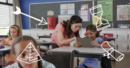 Asian teacher with diverse child students leaning over desk, pointing at tablet near GLASS bin