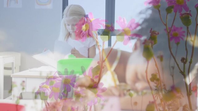 Seated kid focusing on worksheet, writing classwork; standing kid moving green bin, pink overlaying