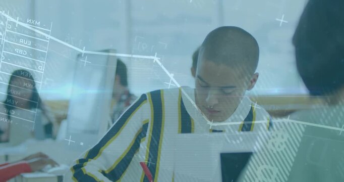 Male student grasping red pen, writing assignment as line graphs drifting over face and monitors