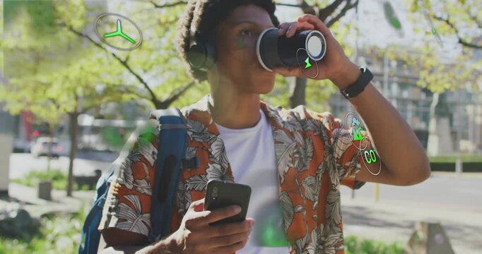 Man scrolling smartphone and sipping coffee on sidewalk, making AR icons forming green orb reading
