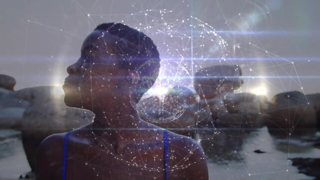 Woman turning head at rock coast glowing sphere rising above, obscuring face showing pools for tech