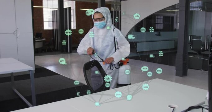 Sanitation worker entering office adjusting sprayer, cleaning surfaces while green icons overlaying