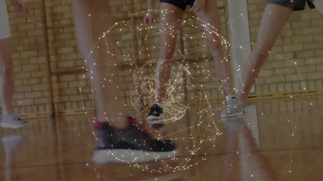 Dribbling Chinese teen in green-striped socks as basketball bouncing into gym, evading defenders