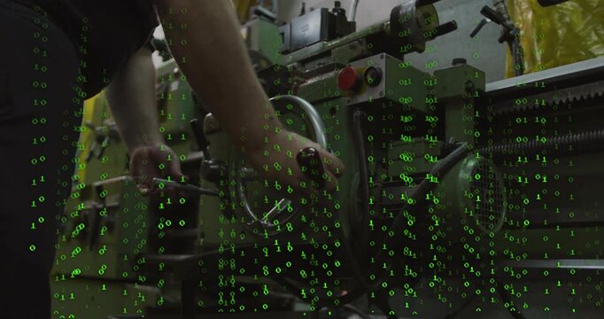 Man reaching for wheel turning and wrenching to set lathe in shop falling green numerals overlaying