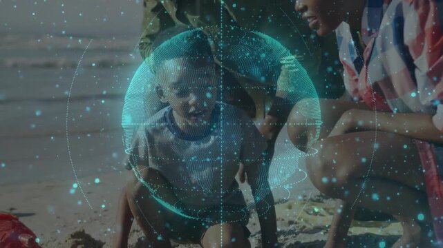 Family sitting shore, holo globe spinning, child digging shovel, adults patting, making child smile