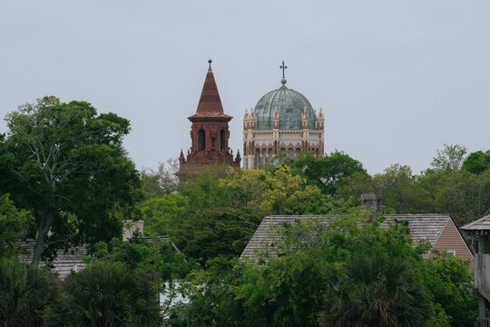 Cathedral Basilica of St. Augustine dome and bell tower rising above historic city rooftops, viewed from Castillo de San Marcos, Florida