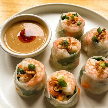 Indonesian siomay bandung dumplings plate, top view flat lay, peanut sauce bowl