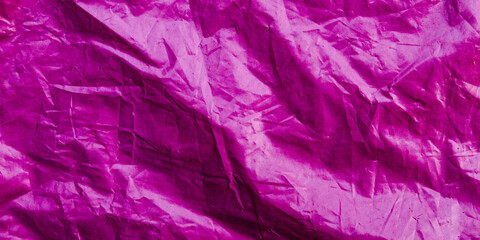 Naklejka premium Crinkled pink plastic sheet background texture