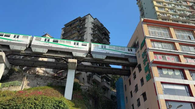 March 10, 2026, at the Liziba Light Rail Station in Yuzhong District, Chongqing, China&mdash;a renowned sight of the city's rail transit passing through a building.