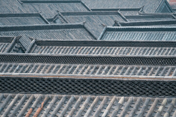 Traditional Ming and Qing dynasty buildings in Qingzhou Ancient City feature elegant gray roof tiles and decorative ridges, showcasing the timeless beauty of classical Chinese architecture.