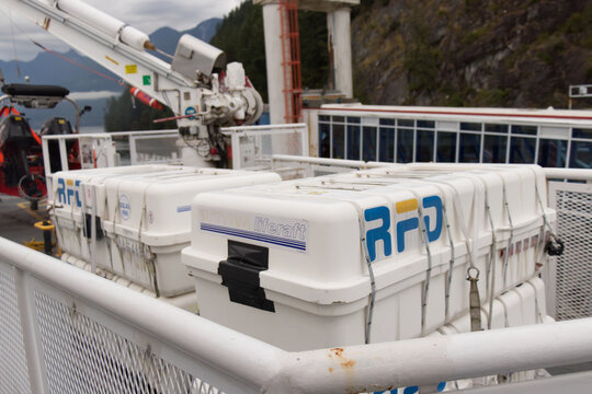 Vancouver, Canada - July 16,2020: RFD liferaft canisters stacked on BC Ferries vessel deck with davit crane