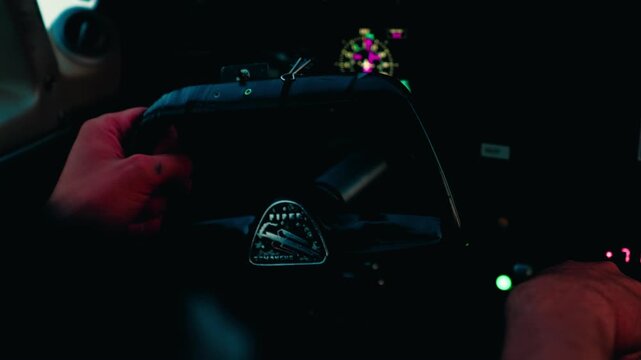 Interior POV of a 1966 Piper PA-30 Twin Comanche cockpit, featuring analog gauges and pilot adjusting throttle.