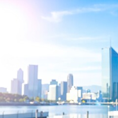 Fototapeta premium Blurry cityscape with towering buildings under a bright sunny sky