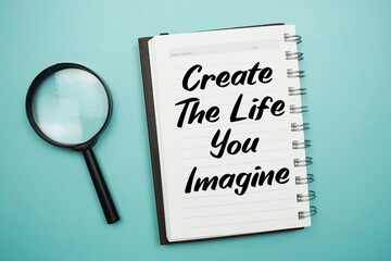 Create the Life You Imagine text written on notepad with magnifying glass